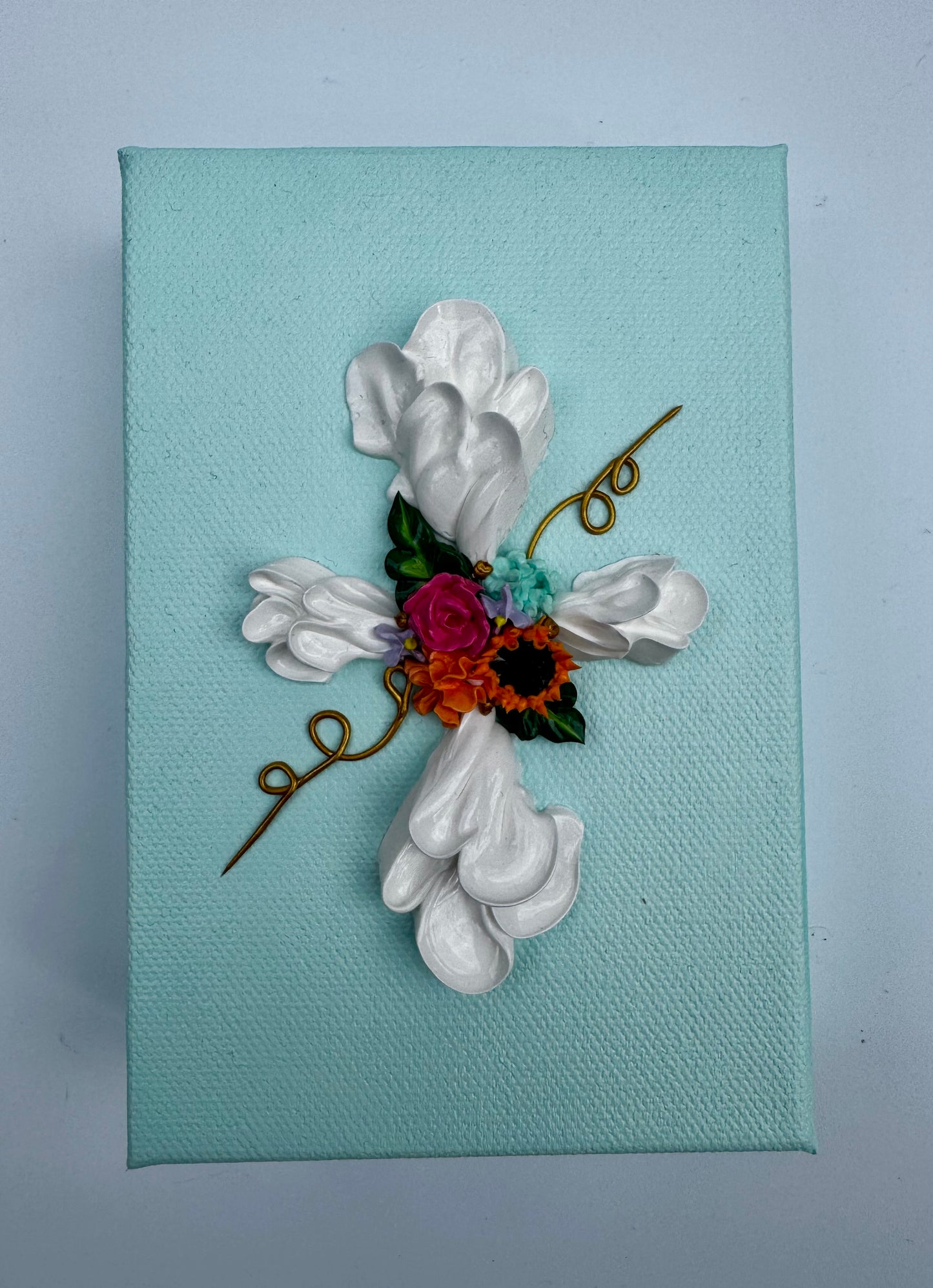 Cross with Assorted Flowers